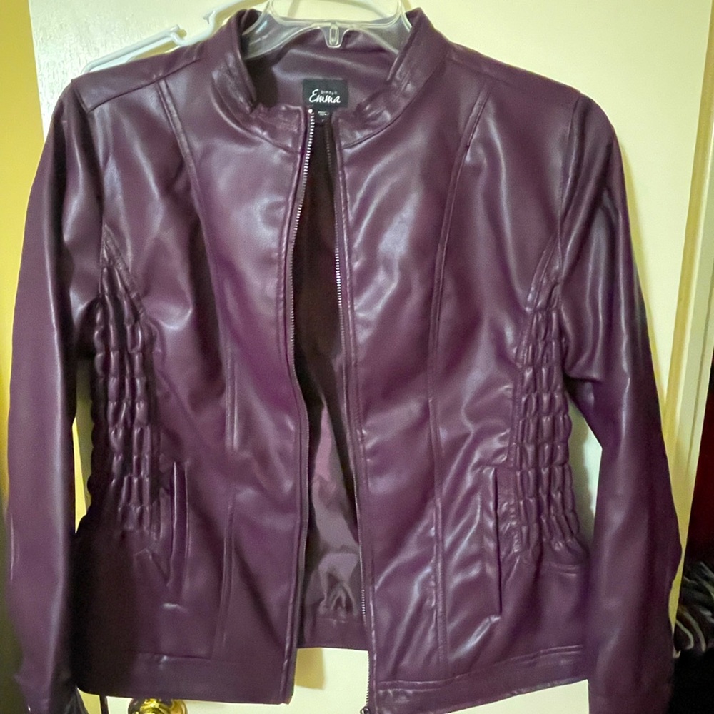 Faux leather jacket.  Very soft and good for dress up or casual.